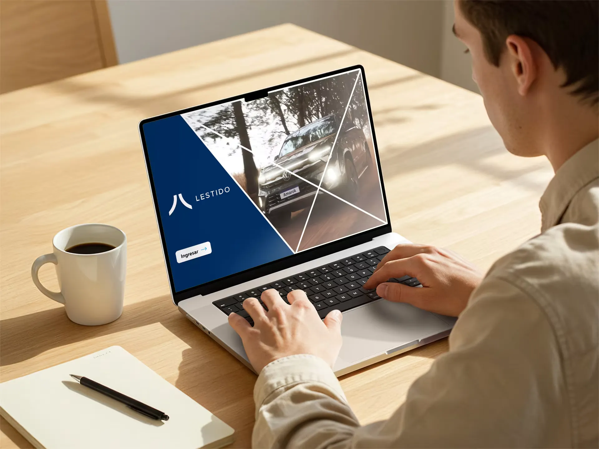 Person working on a laptop with the Lestido brand on screen